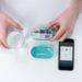 person holding pill box